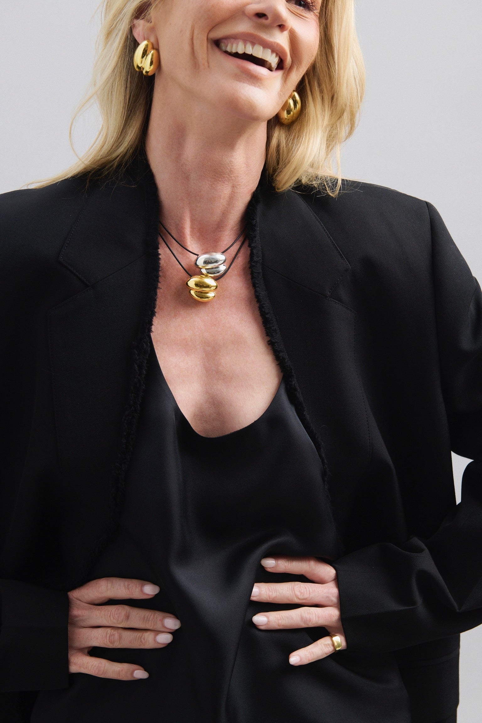 Featuring a sculptural pendant on an adjustable black leather cord, available in 14k gold or sterling silver vermeil.
