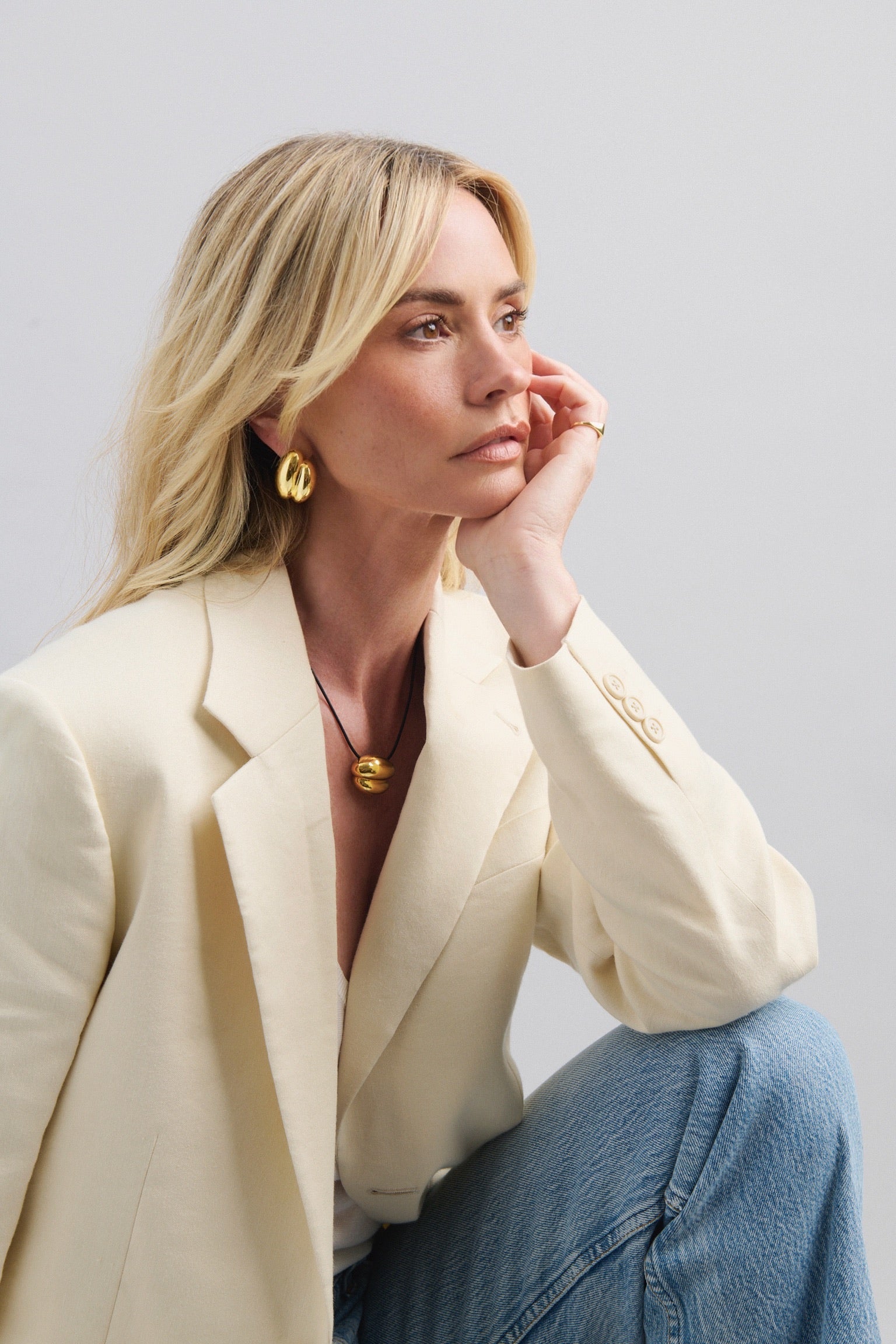 Discover the  Brioche Earrings by MÉGA Jewelry—oversized, sculptural hoops available in 14k gold or sterling silver vermeil. A bold statement piece for any jewelry collection.