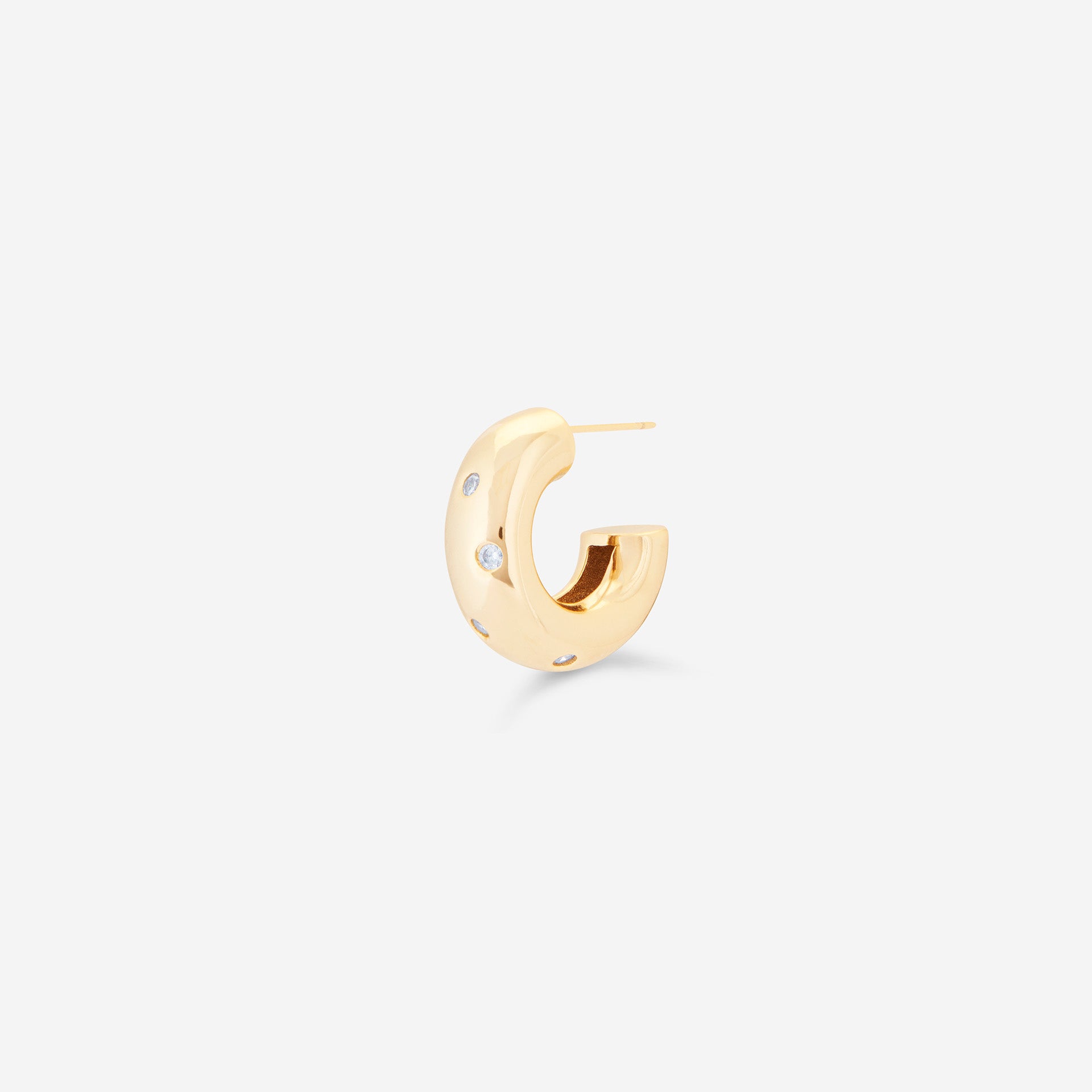 MÉGA Dalmatian Earrings in gold vermeil—sculptural studs with scattered CZ accents, stainless-steel posts, lightweight and refined.