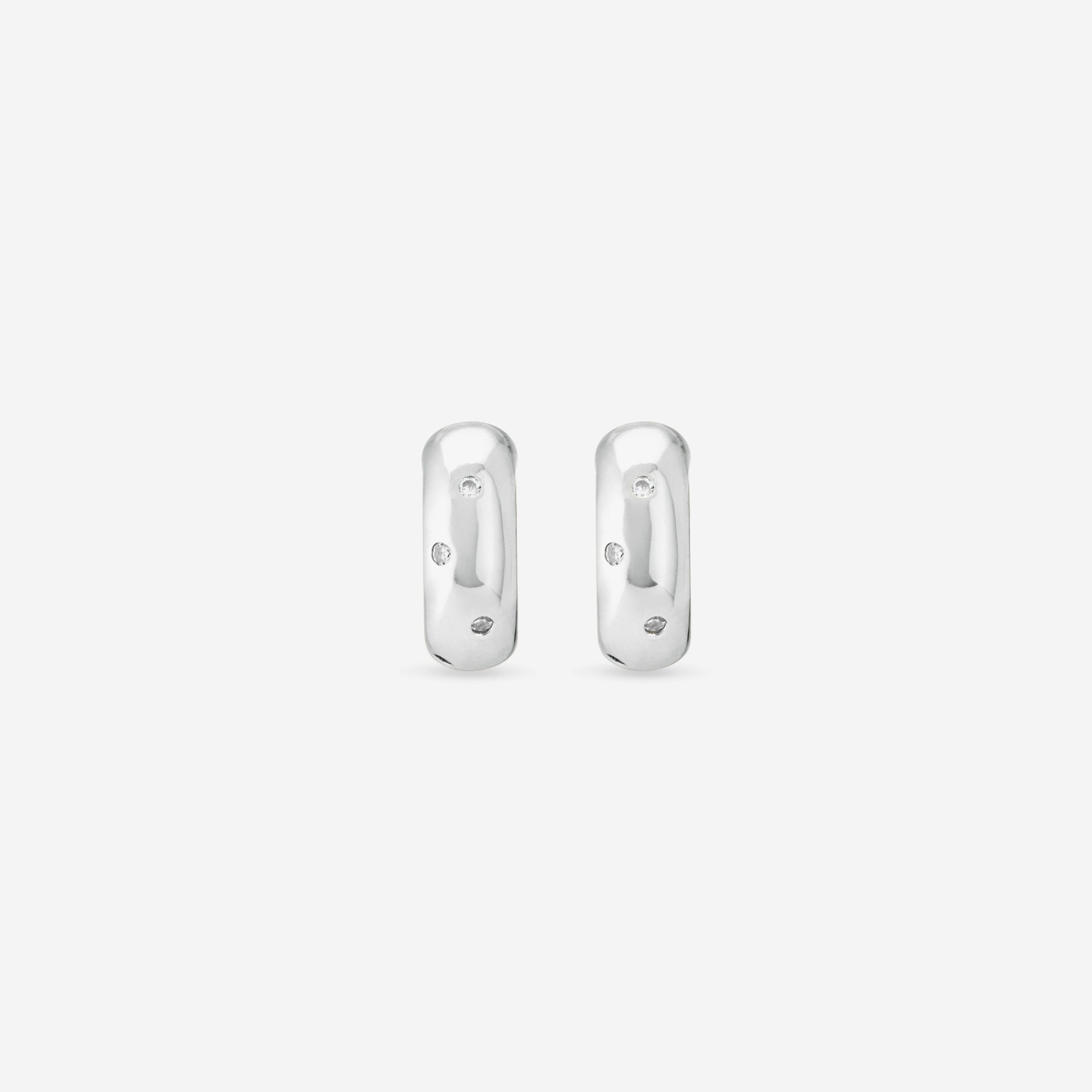 MÉGA Dalmatian Earrings in gold vermeil—sculptural studs with scattered CZ accents, stainless-steel posts, lightweight and refined.