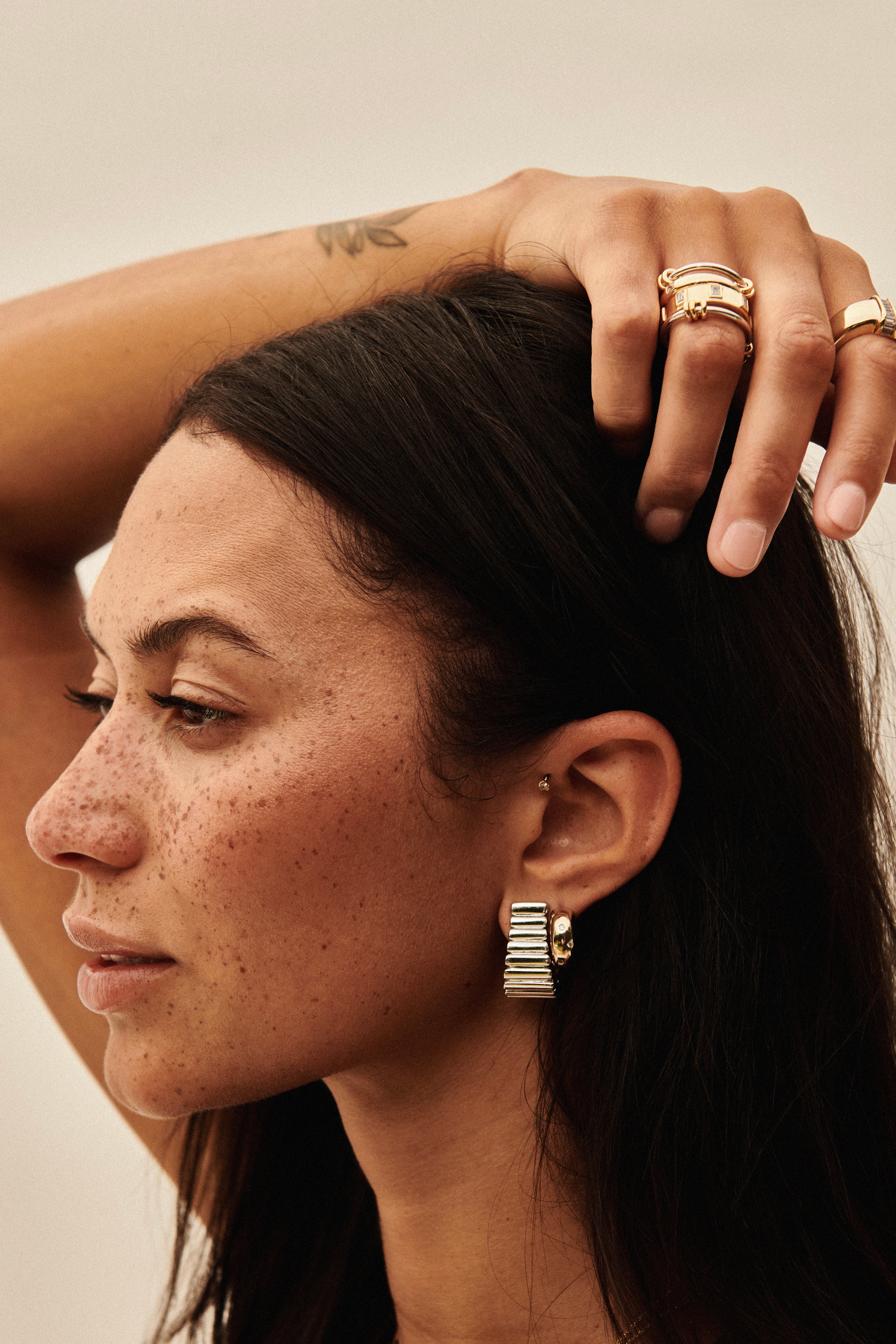 MÉGA Dalmatian Earrings in gold vermeil—sculptural studs with scattered CZ accents, stainless-steel posts, lightweight and refined.
