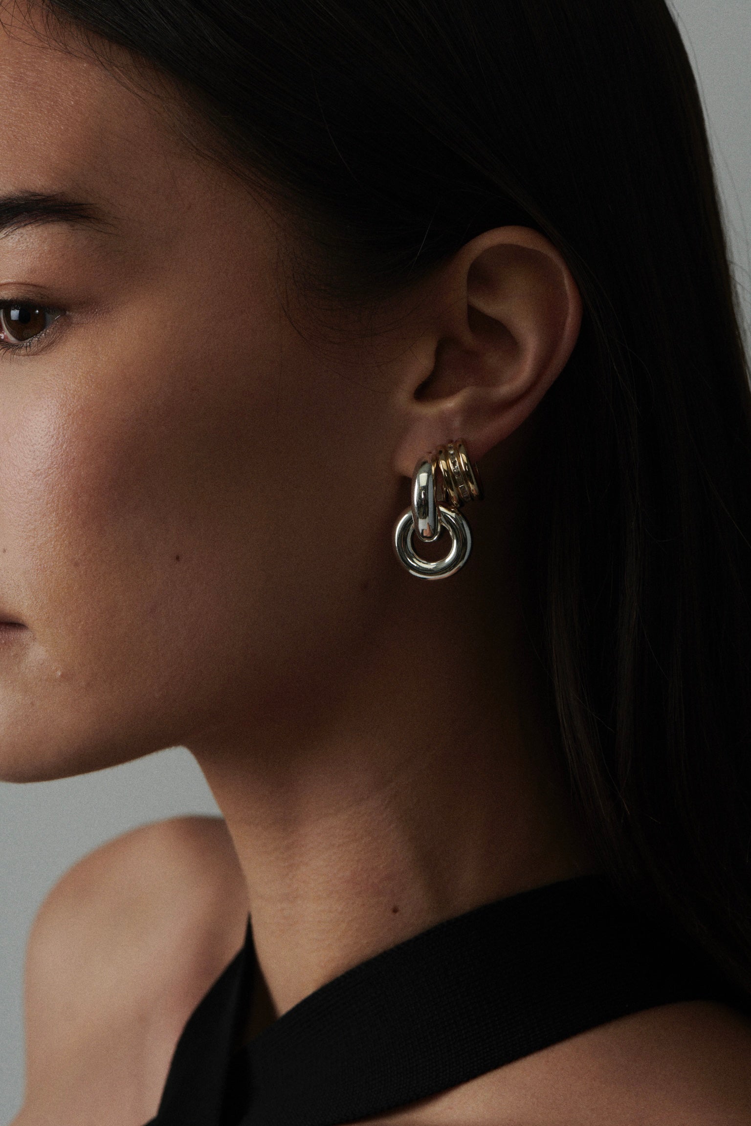 MÉGA Baguetted Earrings in gold vermeil—16 × 7.4 mm mini hoops with channel‑set zircon baguettes, stainless‑steel posts, 8.27 g.