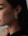 MÉGA Baguetted Earrings in gold vermeil—16 × 7.4 mm mini hoops with channel‑set zircon baguettes, stainless‑steel posts, 8.27 g.