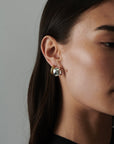 MÉGA Chunky Small Hoop Earrings in gold vermeil—16.5 × 11.5 mm bestselling lightweight hoops, 4 g, with stainless-steel posts.