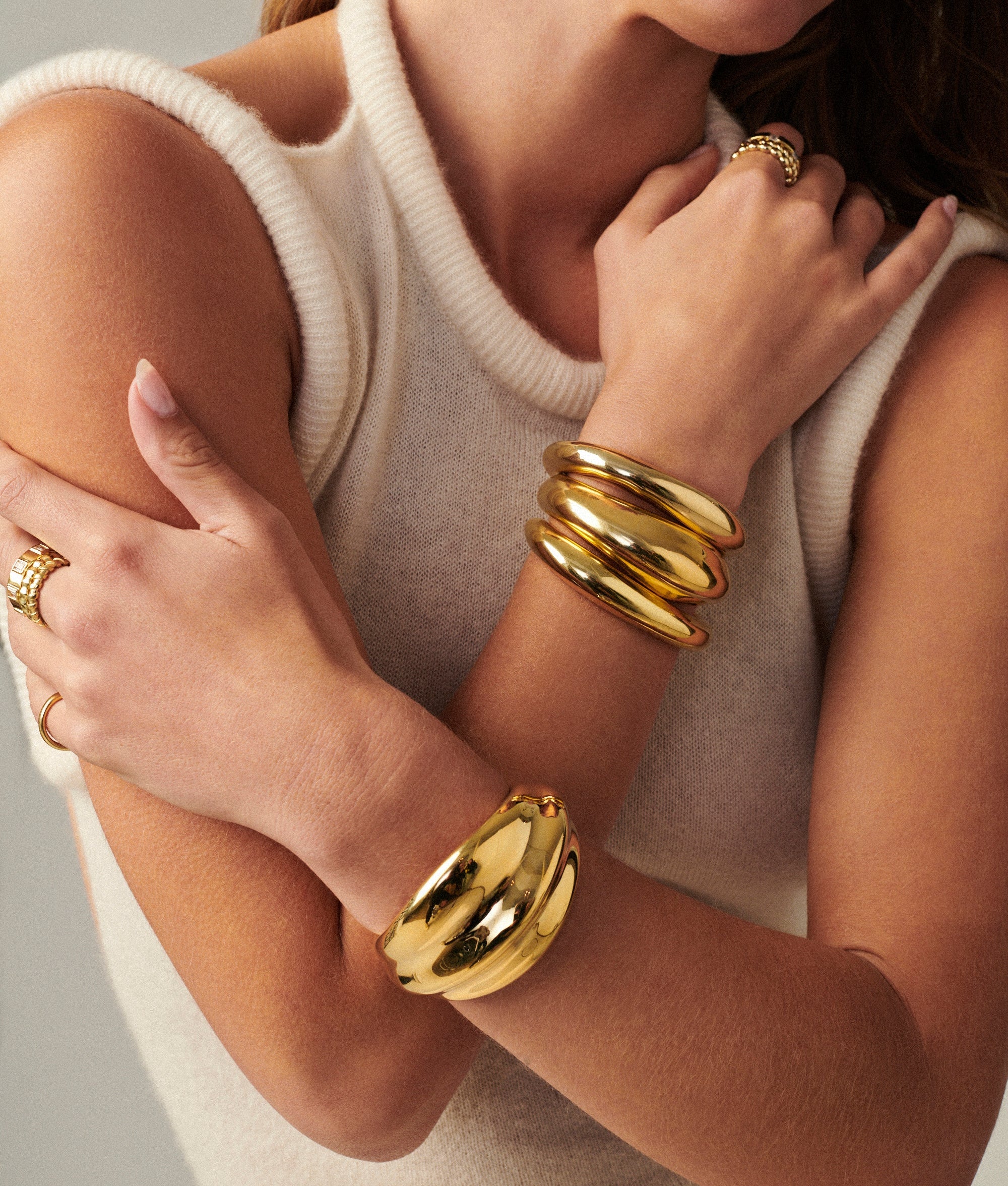 Lightweight brass Wave Cuff styled with minimalist jewelry