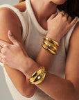 Lightweight brass Wave Cuff styled with minimalist jewelry