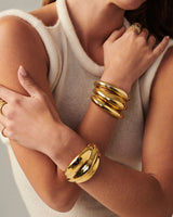 Lightweight brass Wave Cuff styled with minimalist jewelry