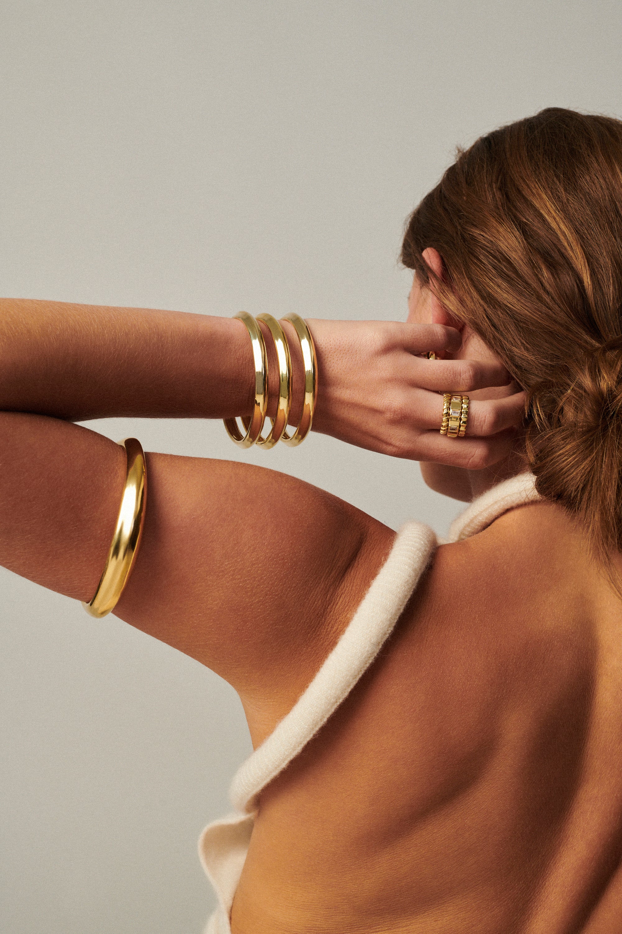 MÉGA Bicep Bangle in gold vermeil—tapered brass upper‑arm cuff, 10.5 mm to 15.6 mm wide, 61.7 g.