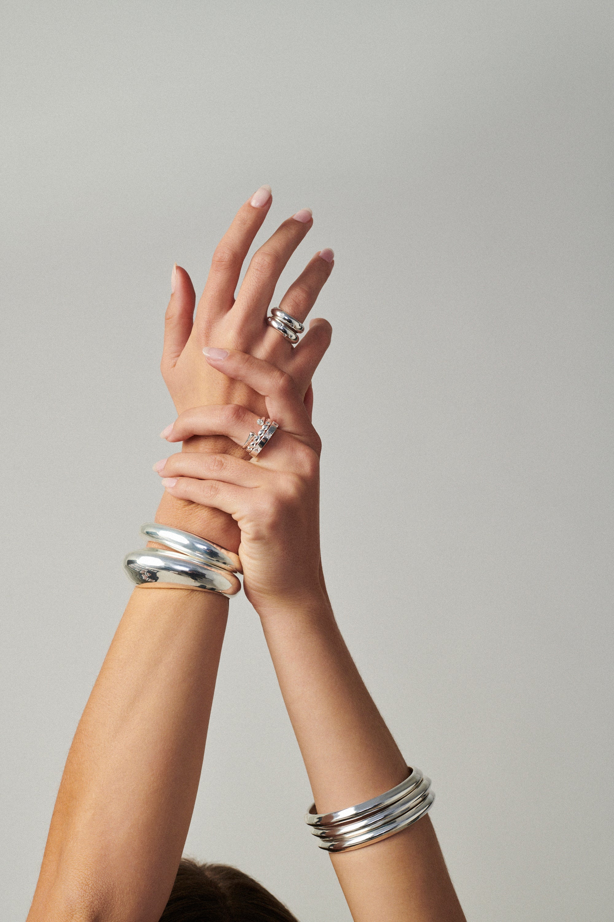 MÉGA Donut Sprinkle Ring Stack—two CZ-dusted hammered donut rings in sterling silver with gold/silver vermeil.