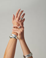 MÉGA Donut Sprinkle Ring Stack—two CZ-dusted hammered donut rings in sterling silver with gold/silver vermeil.