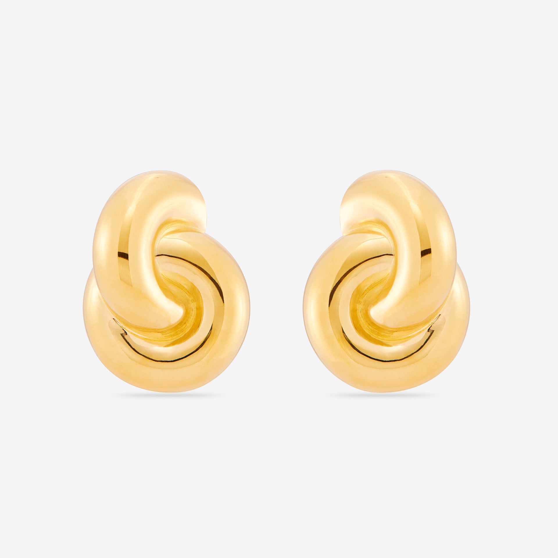 MÉGA Jumbo Double Knot Earrings in gold vermeil—lightweight oversized sculptural knot studs, 28 mm x 37 mm.