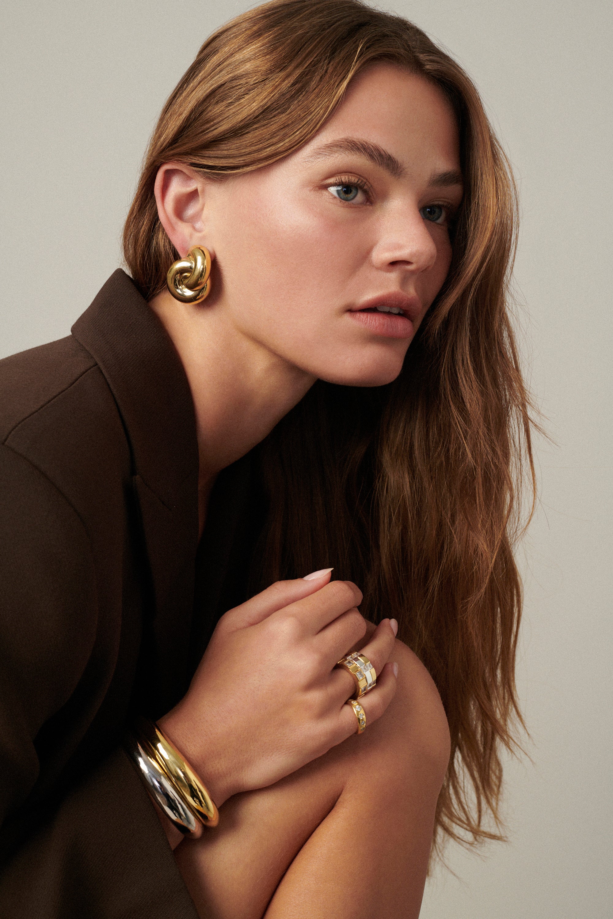 MÉGA Jumbo Double Knot Earrings in gold vermeil—lightweight oversized sculptural knot studs, 28 mm x 37 mm.