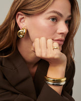 MÉGA Jumbo Double Knot Earrings in gold vermeil—lightweight oversized sculptural knot studs, 28 mm x 37 mm.