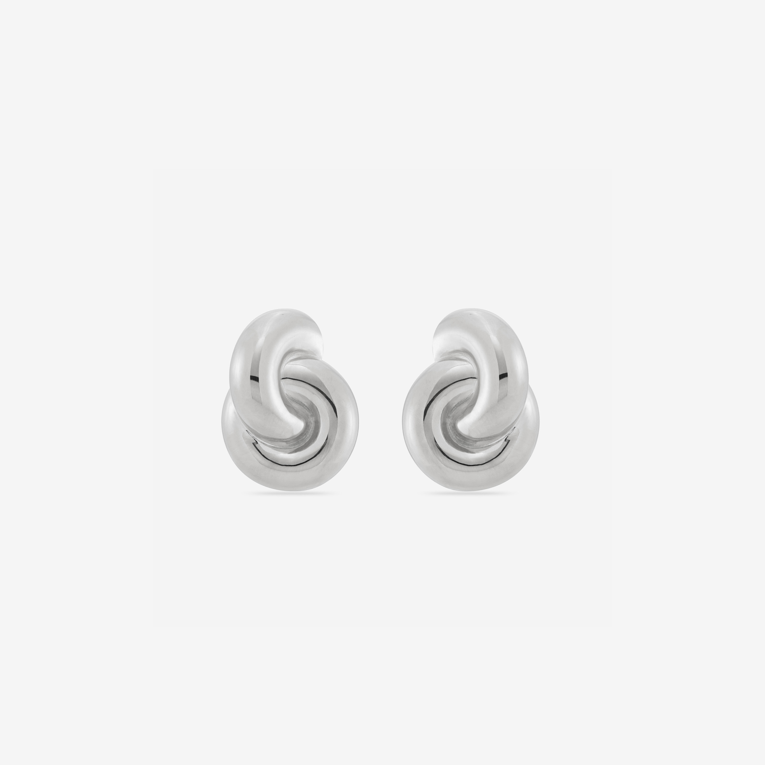 Mini Double Knot Earrings in silver, featuring interlocking loops for a sculptural, polished look.