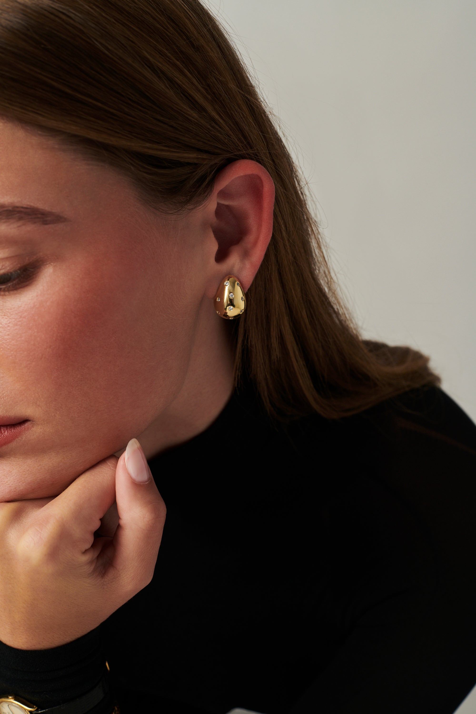 MÉGA Sprinkle Teardrop Earrings in gold vermeil—brass drop earrings sprinkled with CZ stones, 5.5 mm to 14.5 mm wide and 20 mm tall.