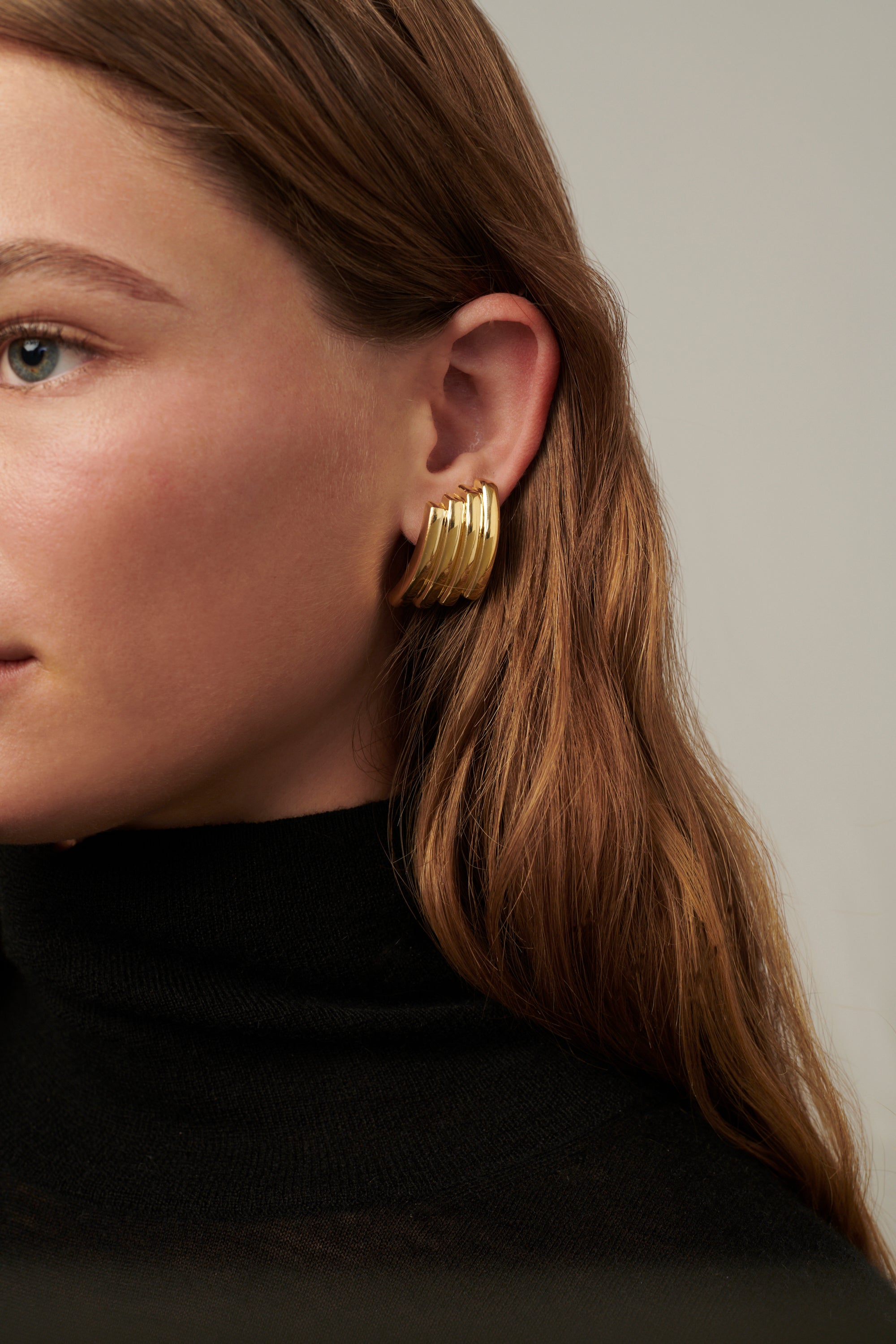 Double-hoop earrings with a sculptural silhouette, crafted in brass with 14k gold vermeil or 925 sterling silver vermeil—lightweight and bold.