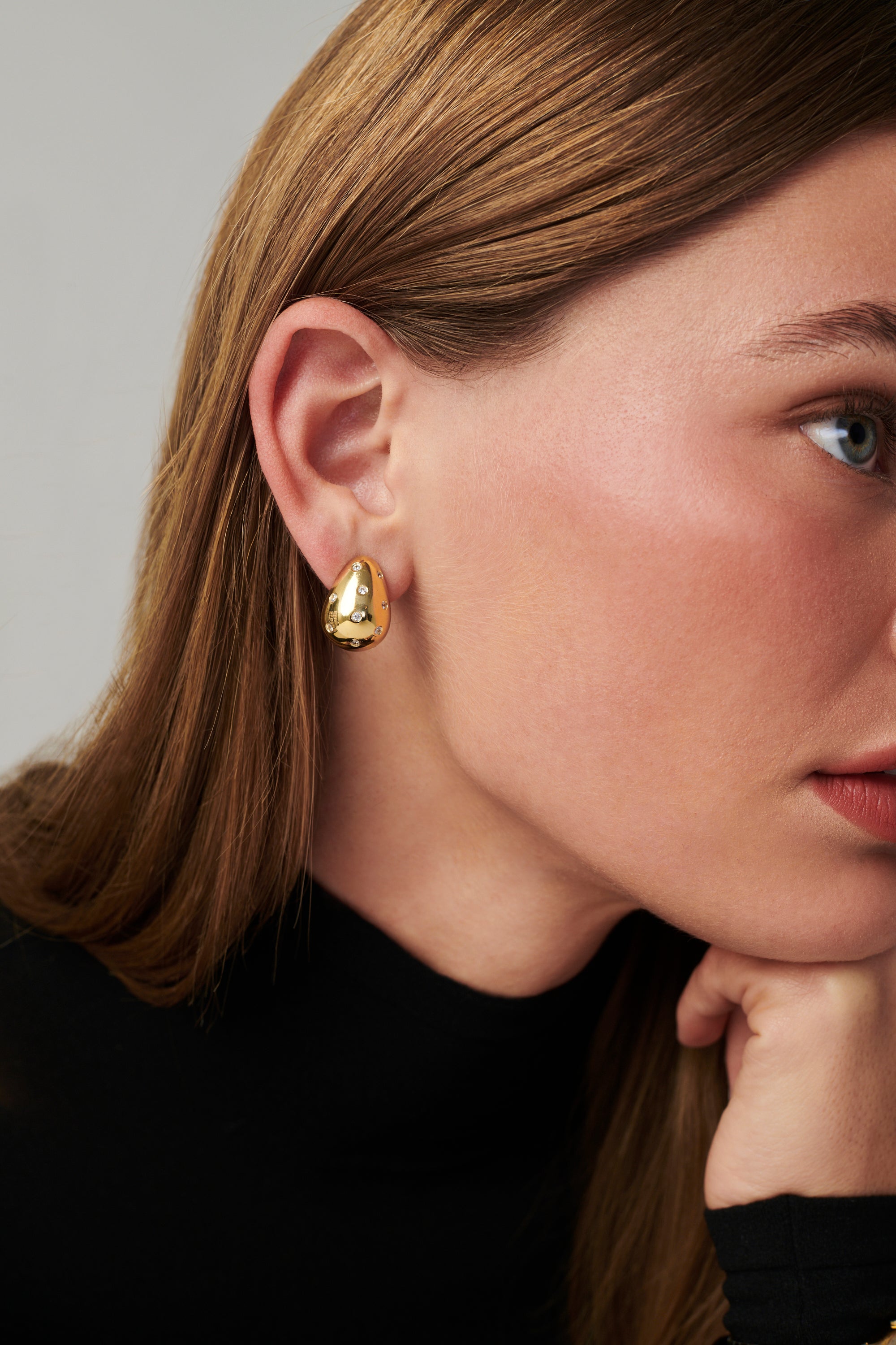 MÉGA Sprinkle Teardrop Earrings in gold vermeil—brass drop earrings sprinkled with CZ stones, 5.5 mm to 14.5 mm wide and 20 mm tall.