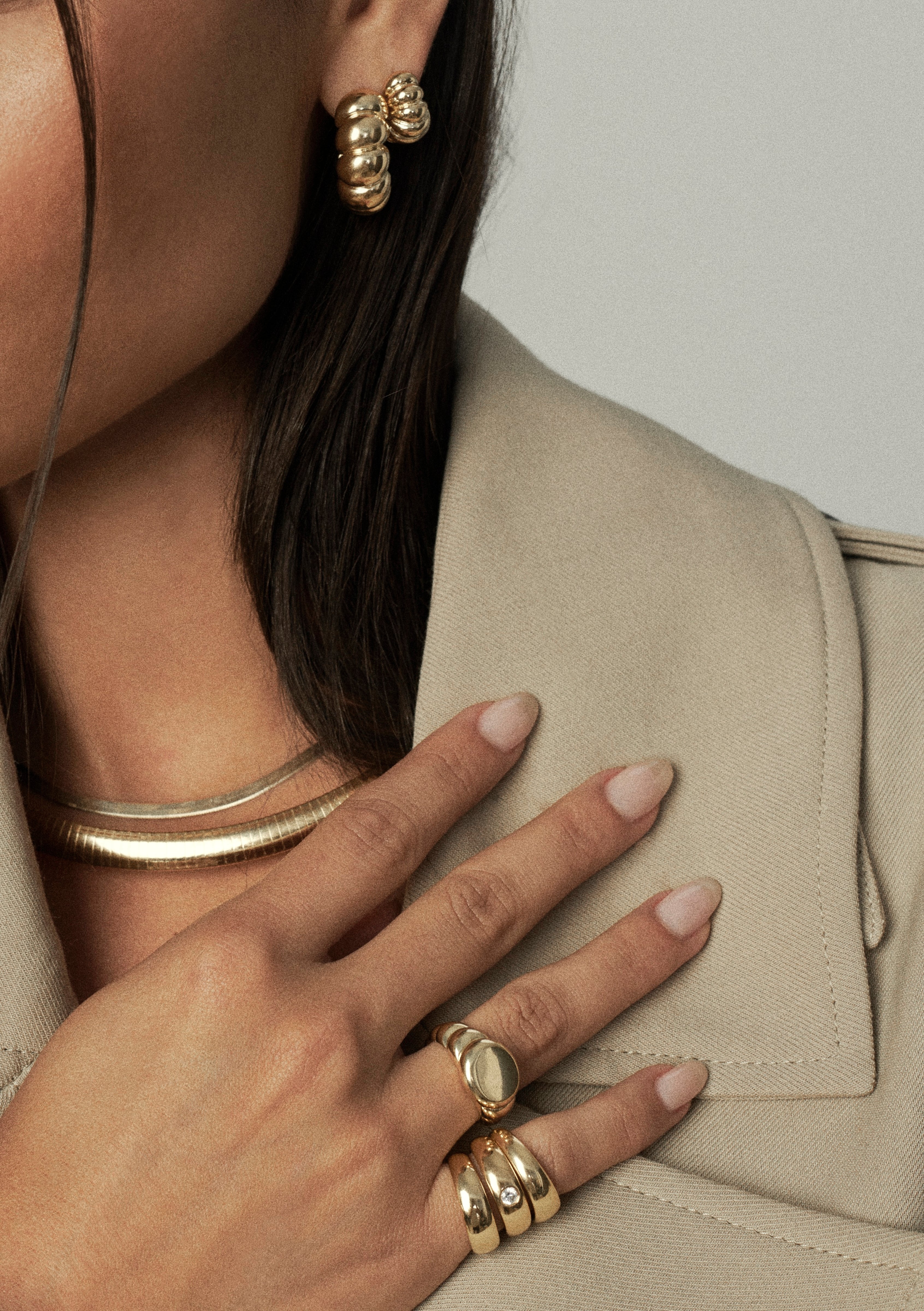 Two interlocking gold vermeil sterling silver pinky rings—one plain band and one set with a 3.5mm CZ, styled together