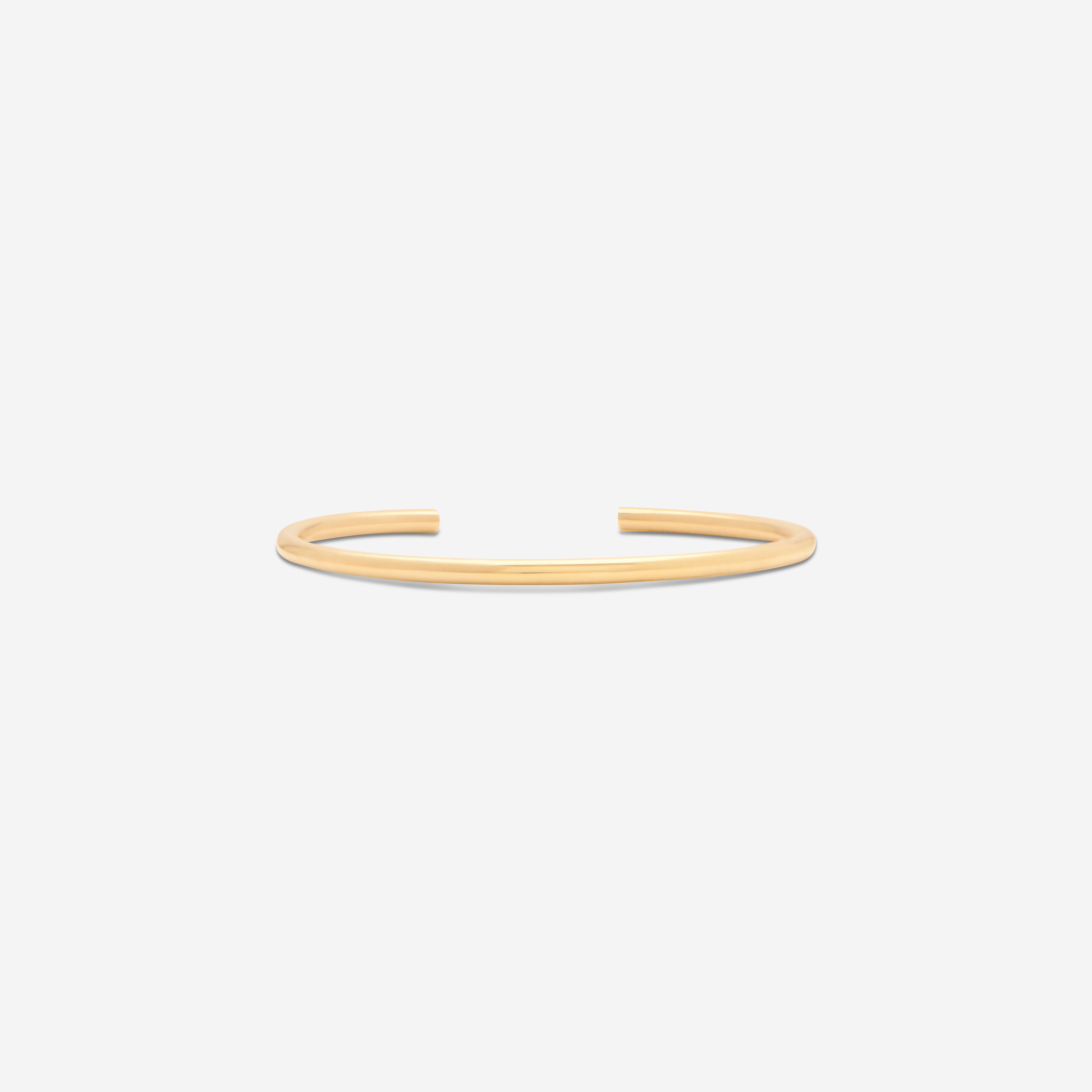 MÉGA Open Cuff Bracelet—3 mm gold-finished sterling cuff, 60 mm width, rounded oval silhouette, weighs 11.87 g.