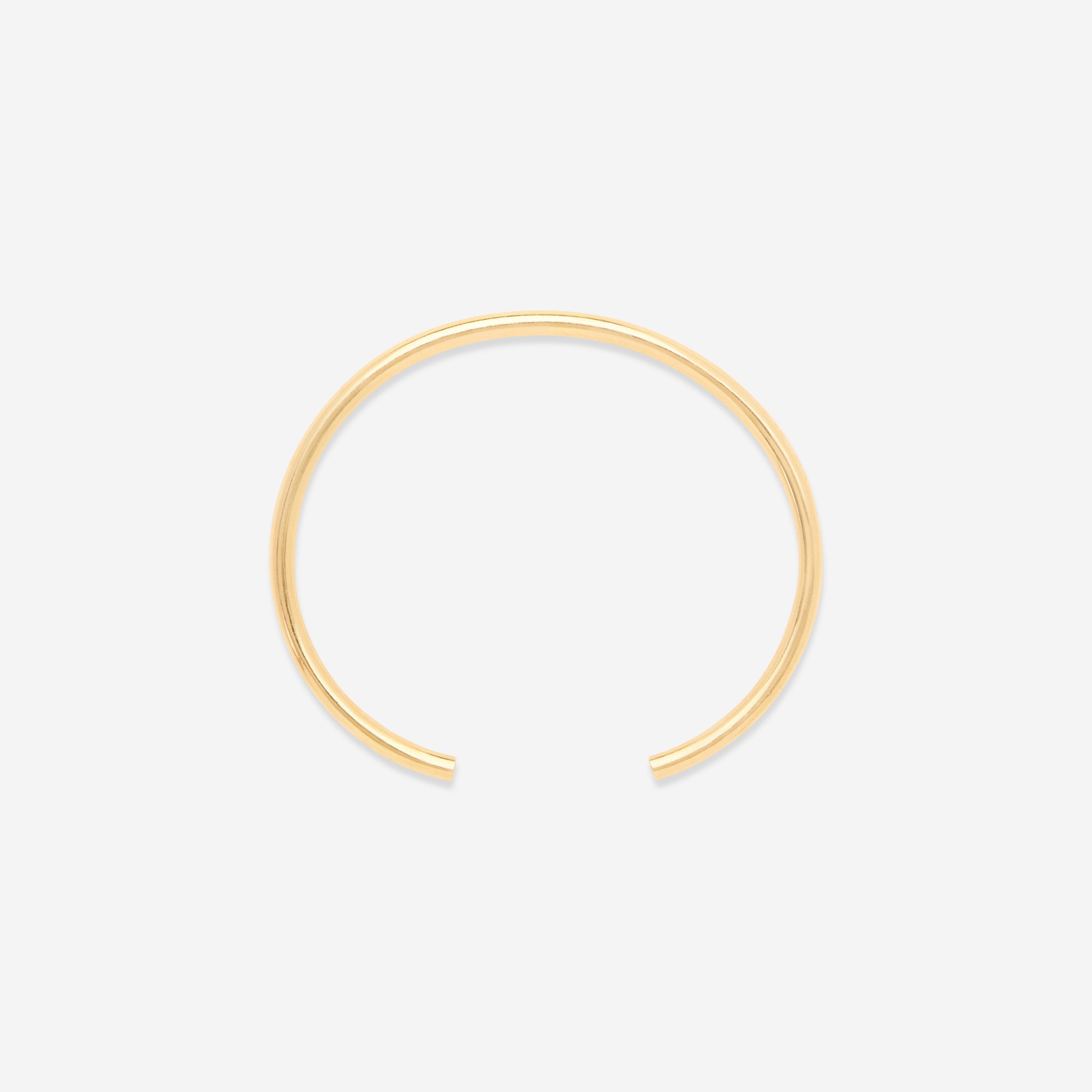 MÉGA Open Cuff Bracelet—3 mm gold-finished sterling cuff, 60 mm width, rounded oval silhouette, weighs 11.87 g.
