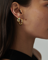 MÉGA Twisted Hoop Earrings in gold vermeil—twisted 28 mm × 6.5 mm hoop studs with stainless‑steel posts, lightweight 7.55 g.