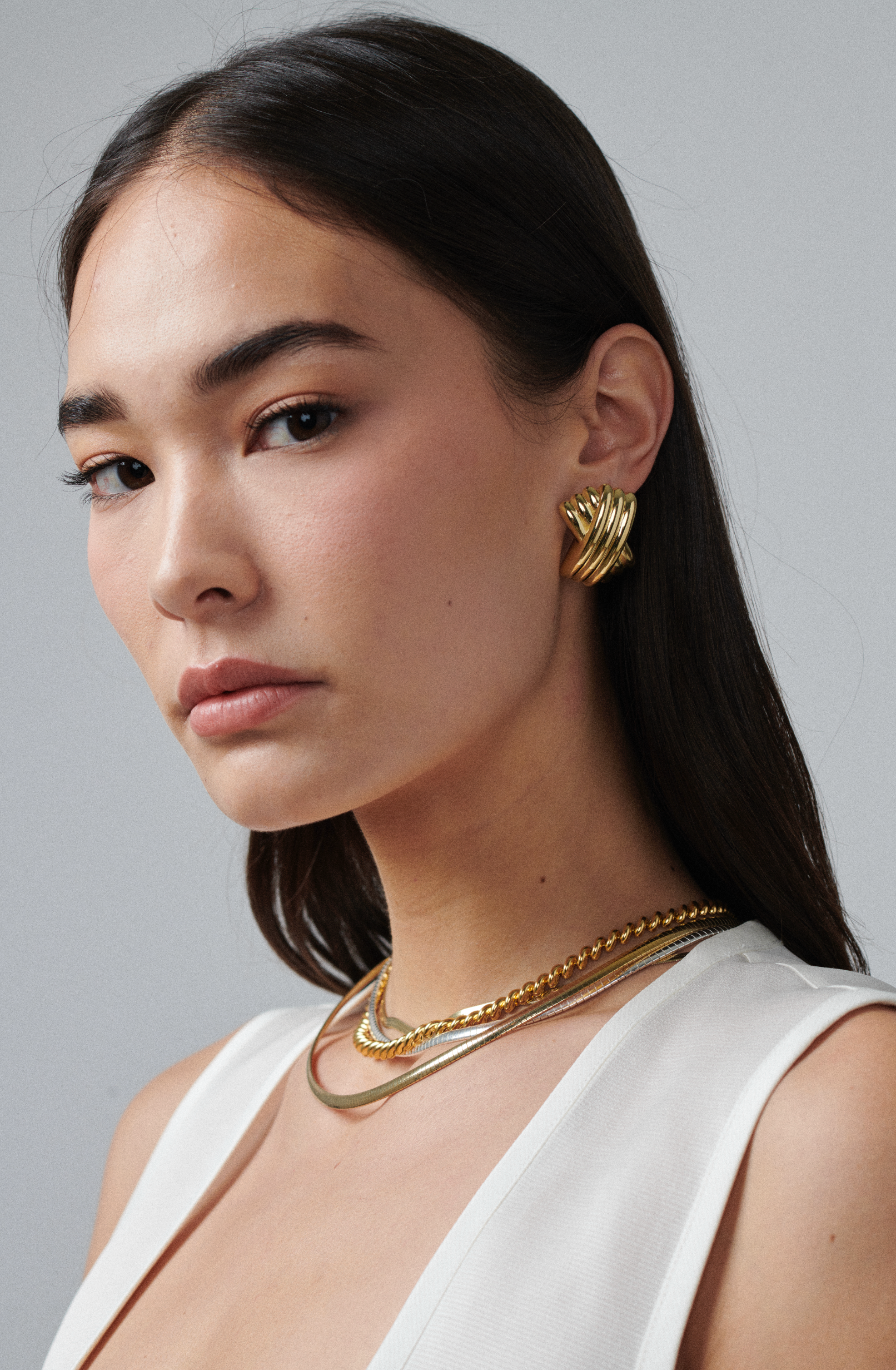 MÉGA Triple X Earrings in gold vermeil—29×19.9 mm overlapping “X” studs with stainless-steel posts, 10 g.