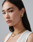 MÉGA Triple X Earrings in gold vermeil—29×19.9 mm overlapping “X” studs with stainless-steel posts, 10 g.