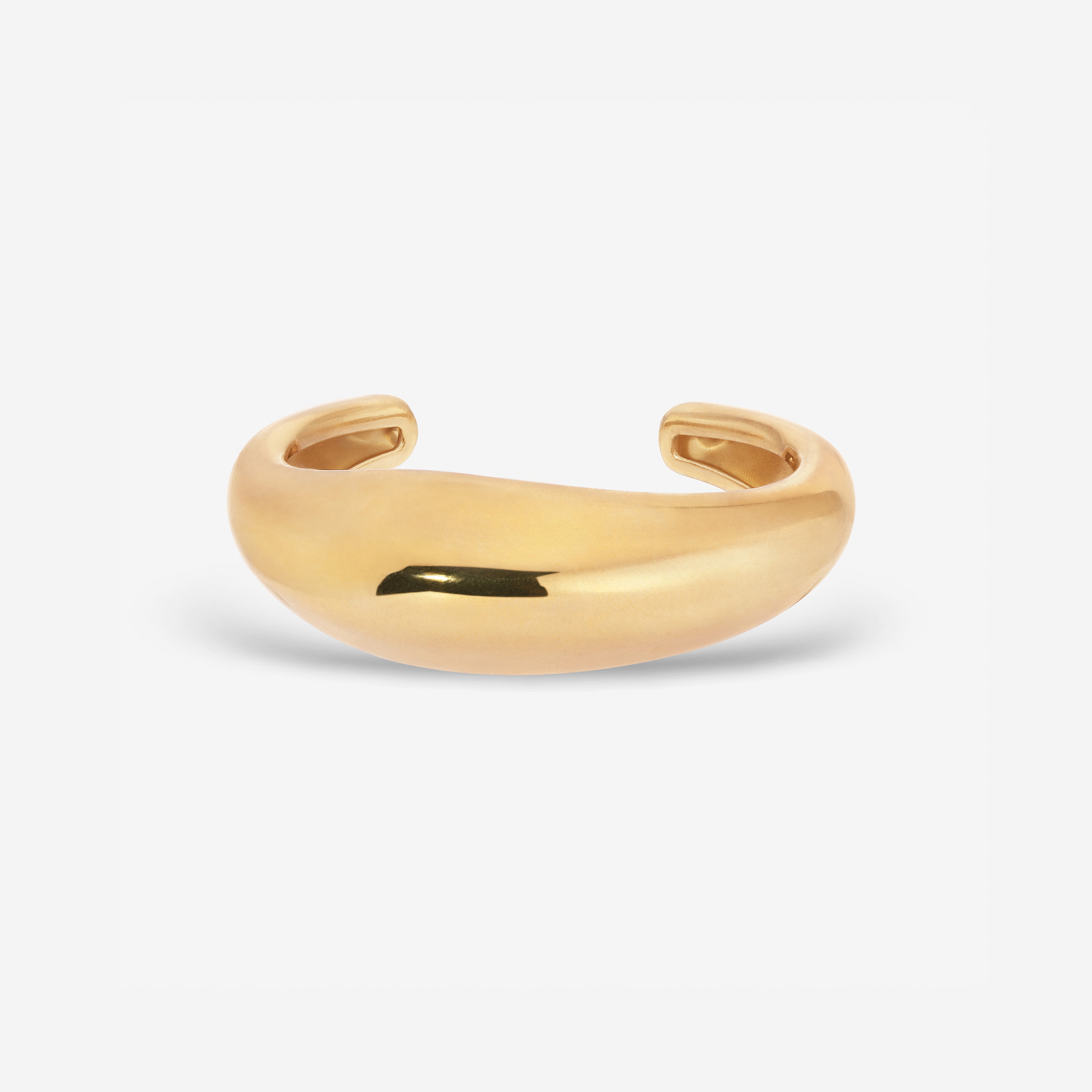 Lightweight brass Wave Cuff styled with minimalist jewelry