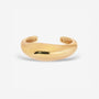 Lightweight brass Wave Cuff styled with minimalist jewelry