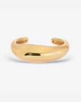 Lightweight brass Wave Cuff styled with minimalist jewelry