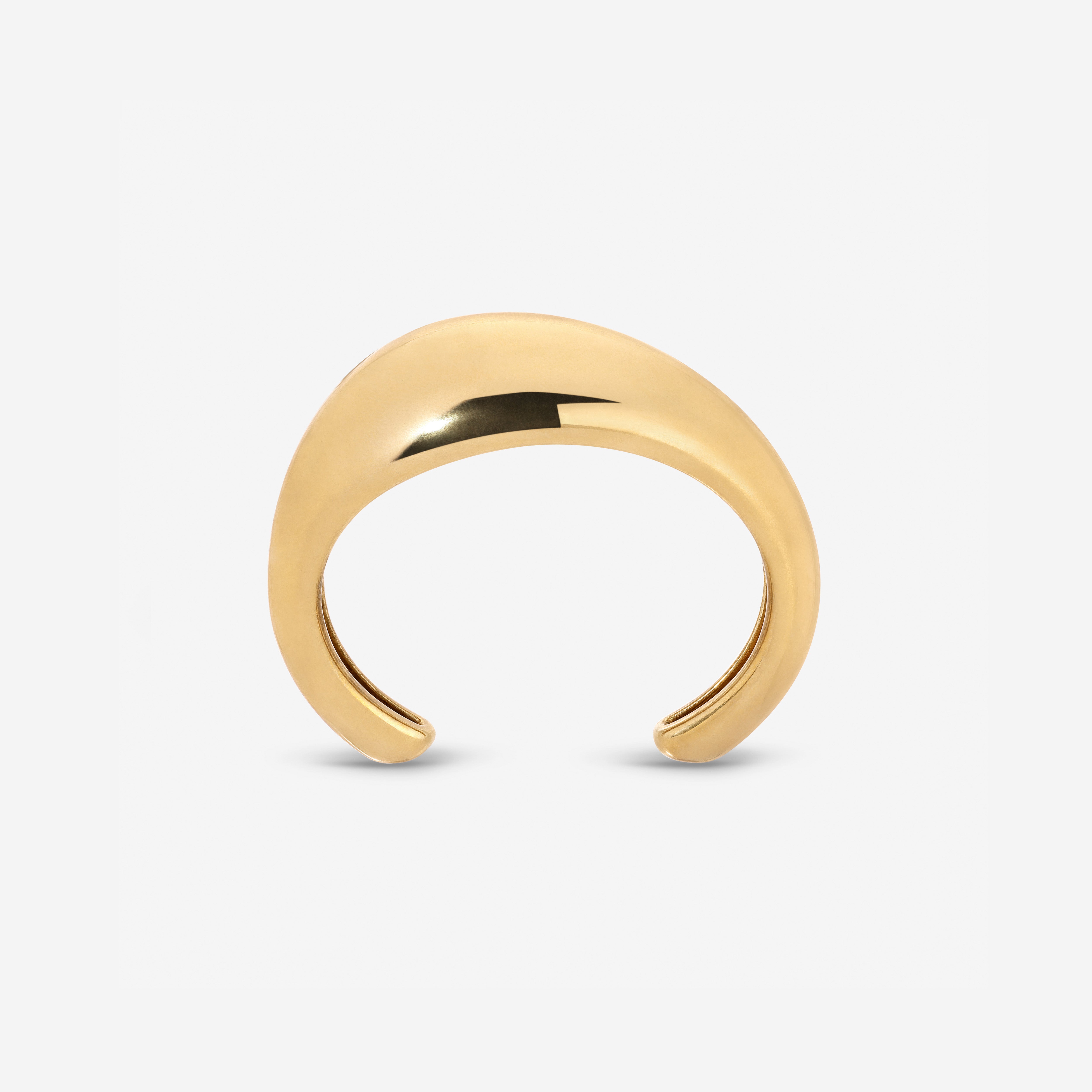 Lightweight brass Wave Cuff styled with minimalist jewelry
