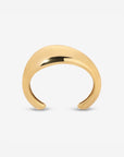 Lightweight brass Wave Cuff styled with minimalist jewelry