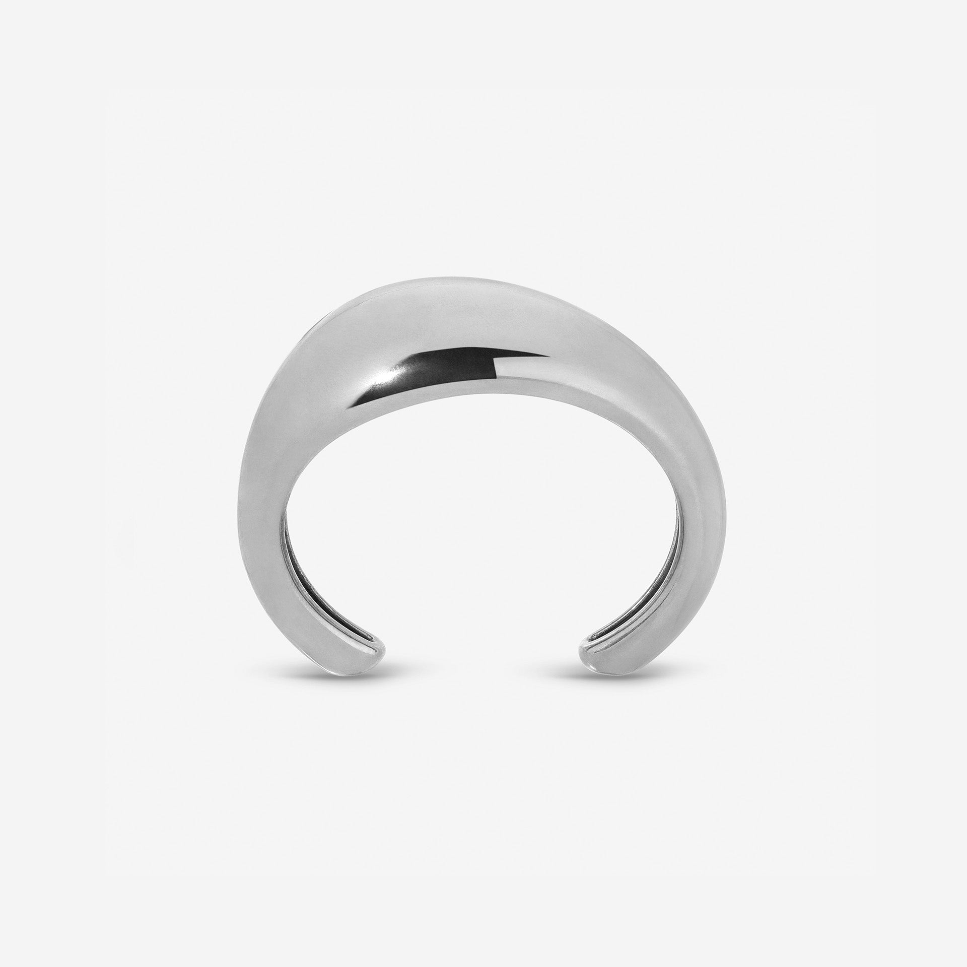 Lightweight brass Wave Cuff styled with minimalist jewelry