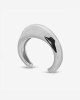 Lightweight brass Wave Cuff styled with minimalist jewelry