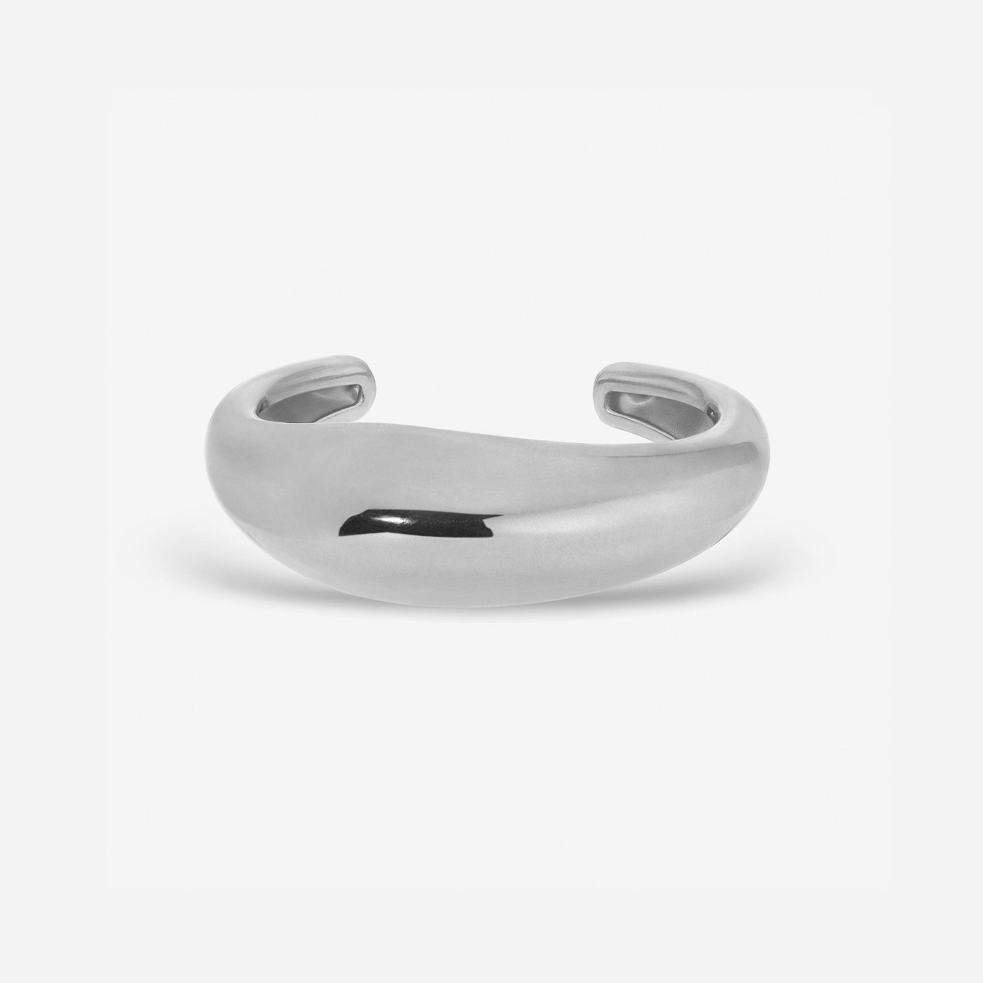 Lightweight brass Wave Cuff styled with minimalist jewelry