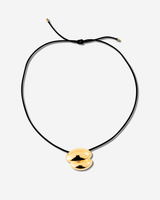 Featuring a sculptural pendant on an adjustable black leather cord, available in 14k gold or sterling silver vermeil.