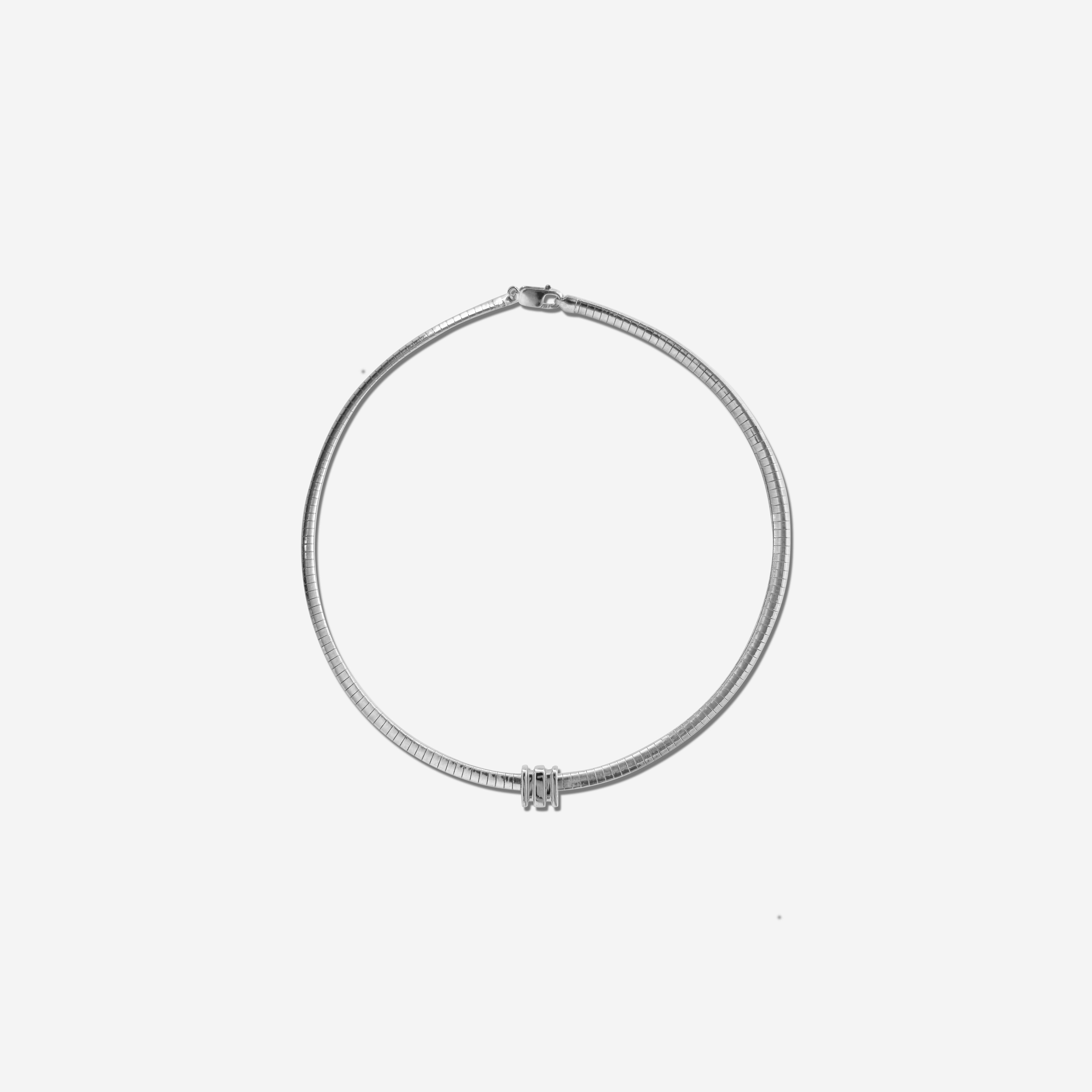 Small Omega Charm in gold, designed for the Omega 4 Necklace – delicate, polished, and stackable.