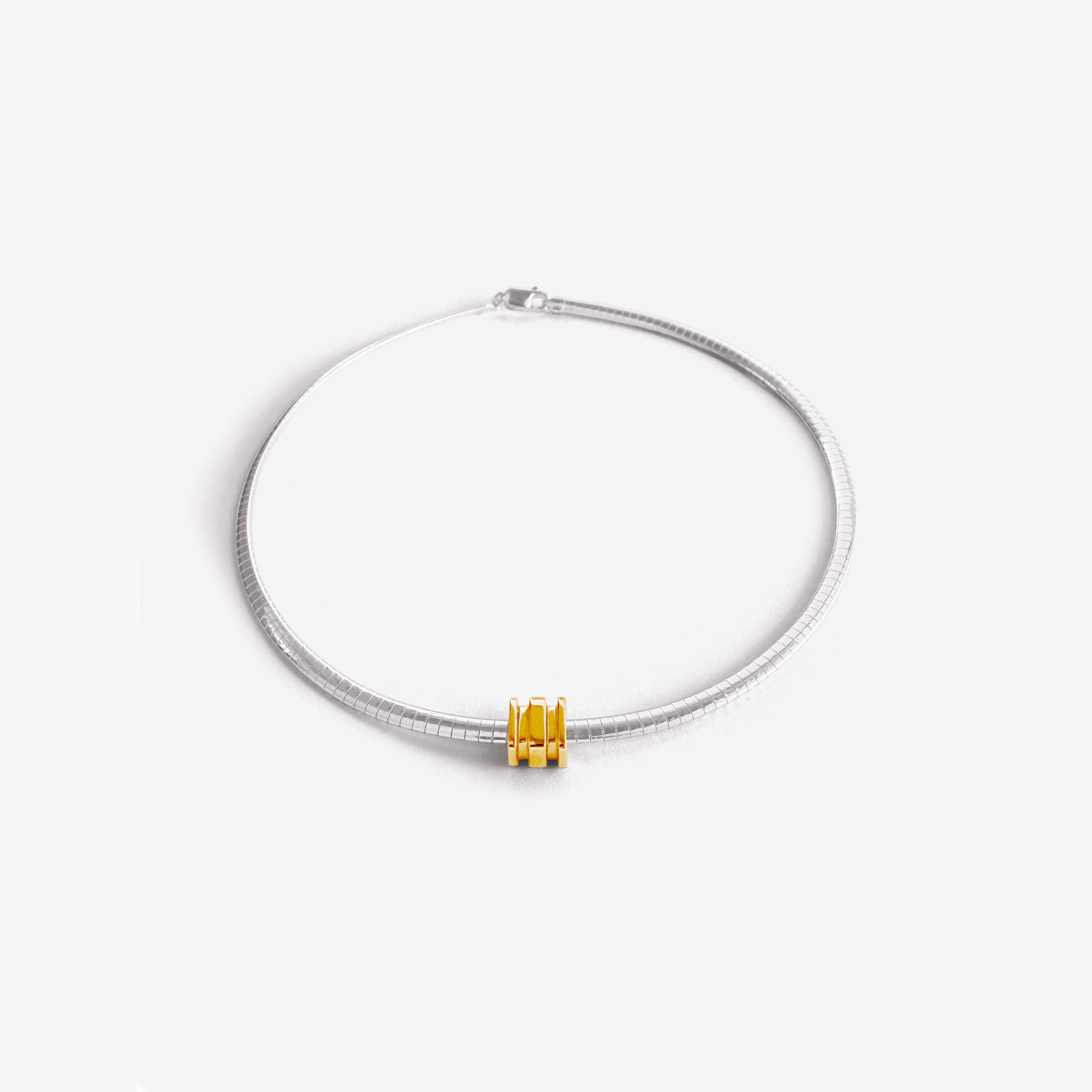 Small Omega Charm in gold, designed for the Omega 4 Necklace – delicate, polished, and stackable.