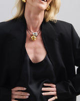 Featuring a sculptural pendant on an adjustable black leather cord, available in 14k gold or sterling silver vermeil.