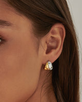 MÉGA Crossover Ring in gold vermeil—intertwined dual-band ring (approx. 5 mm width), lightweight (~8 g), polished and sculptural.