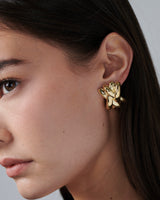 Pair of gold vermeil lattice earrings with interwoven sculptural design, displayed on a white background