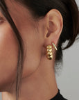 MÉGA Jewelry Chunky Bubble Earrings in Gold on model 