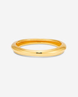 MÉGA Bicep Bangle in gold vermeil—tapered brass upper‑arm cuff, 10.5 mm to 15.6 mm wide, 61.7 g.