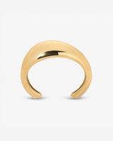 Lightweight brass Wave Cuff styled with minimalist jewelry