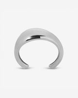 Lightweight brass Wave Cuff styled with minimalist jewelry