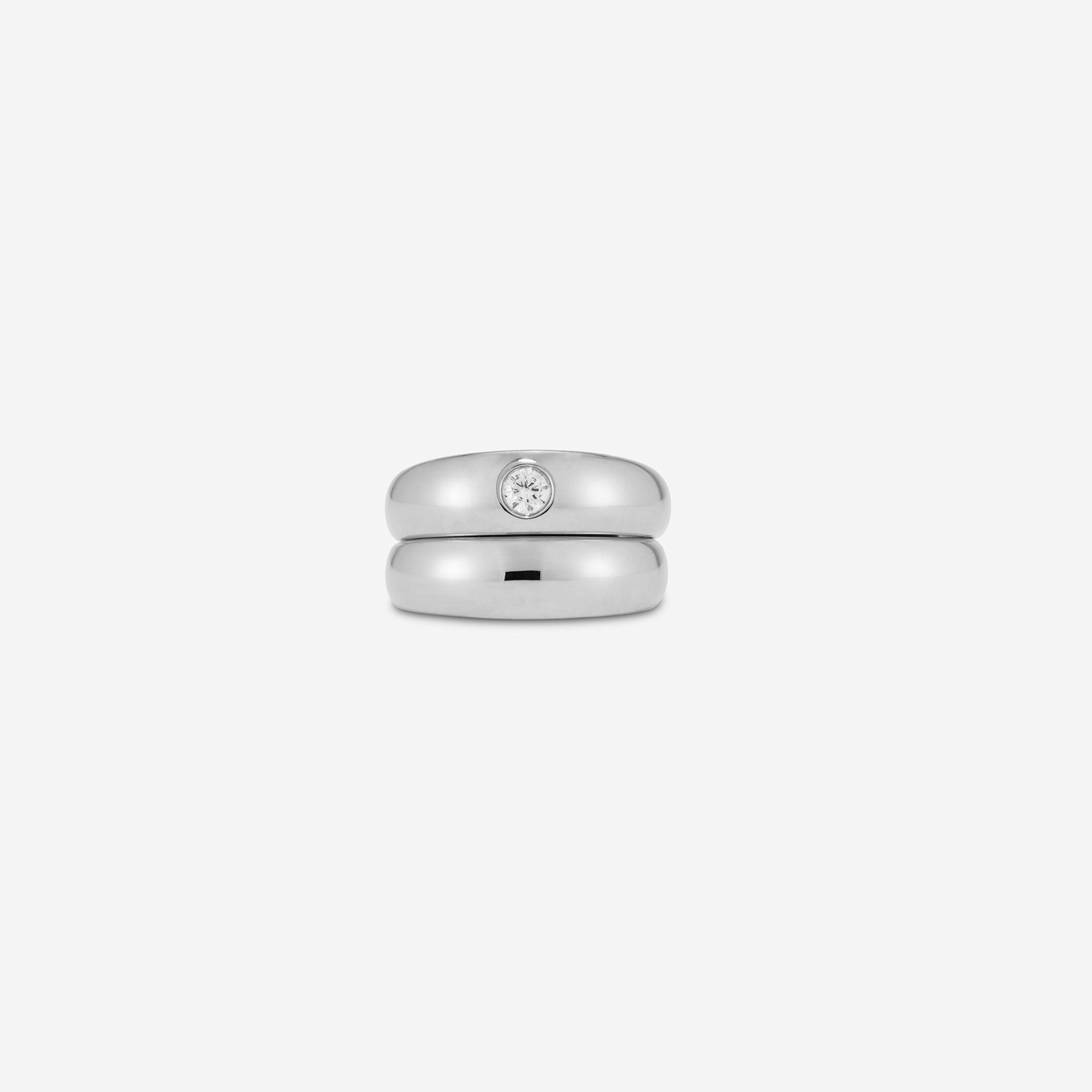 Two interlocking gold vermeil sterling silver pinky rings—one plain band and one set with a 3.5mm CZ, styled together
