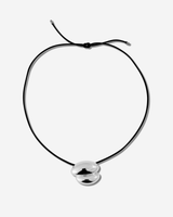 Featuring a sculptural pendant on an adjustable black leather cord, available in 14k gold or sterling silver vermeil.