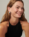 Chunky sculptural hoop earrings with a bold, rounded silhouette – lightweight and easy to wear daily.